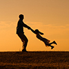 Father and daughter enjoy spending time together outdoor.