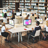 Young students using computers in libraries